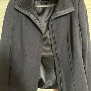 Navy blue Elie tahari jacket with a zipper. Hardly worn!